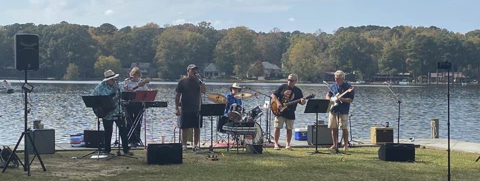 Still Kickin Band performing beside the lake in Sanford, North Carolina